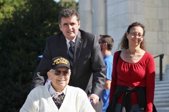 Congressman Mike Fitzpatrick (R-Bucks) pushes a veteran to a waiting bus. Credit: Tom Sofield/LevittownNow.com