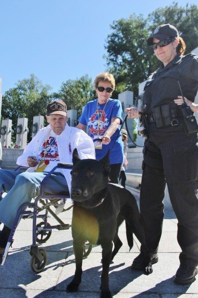 A World War II veteran, his guardian, a United State Park Police officer and her explosive-sniffing dog. Credit: Tom Sofield/LevittownNow.com