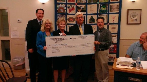 Officials from Langhorne Borough, the Bucks County Redevelopment Authority and State Senator Tommy Tomlinson holding a check for $485,000. The grant money will help pay for a more than $500,000 project that upgraded traffic signals at key intersections throughout the borough.  Credit: Tom Sofield/LevittownNow.com