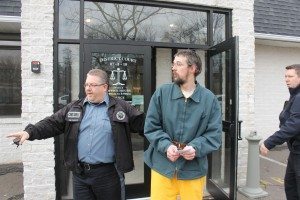 Bucks County Constables Mick Petrucci and Robert Wagner lead Dwayne Achuff out of court Tuesday.  Credit: Tom Sofield/LevittownNow.com