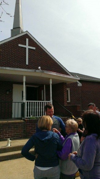 Pastor Ross Manders talks with church members Sunday morning.  Credit: Tom Sofield/LevittownNow.com