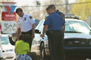Police speak with the victim and an unidentified woman Wednesday afternoon. Credit: Tom Sofield/LevittownNow.com