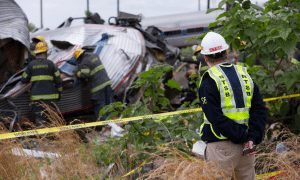 An investigator at the scene of the crash.  Credit: NTSB