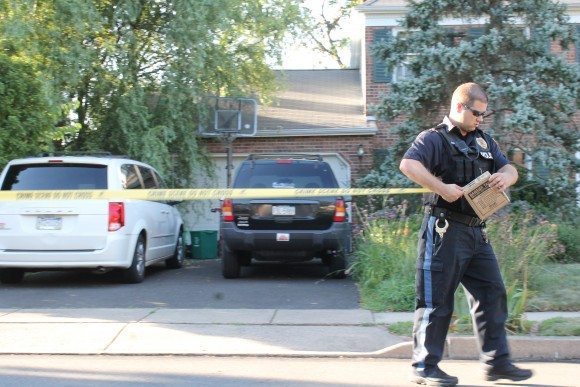 Police put caution tape up outside the home as neighbors and a TV cameraman arrived.  Credit: Tom Sofield/LevittownNow.com