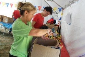 PECO employee Laura Bauerle of Hatboro helps stuff a bag.  Credit: Tom Sofield/LevittownNow.com