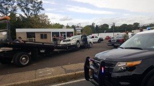 McCain's silver Lexus is towed away from the crash scene in Penndel. Credit: Adam Davis/Submitted