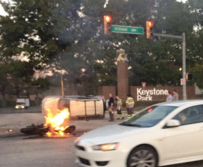 UPDATED: Motorcycle Catches Fire, SUV Overturns In Crash