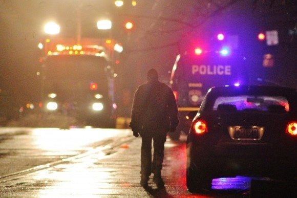 A pedestrian walks on Bath Road past the scene.  Credit: Tom Sofield/LevittownNow.com