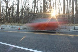 A car travels over South Flowers Mill Road an hour after it reopened on Wednesday.  Credit: Tom Sofield/LevittownNow.com