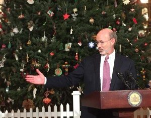 Gov. Tom Wolf gestures during Monday’s tree-lighting ceremony at the state Capitol. The governor on Friday nominated a former employee of his family’s kitchen cabinet business to serve on the Pennsylvania Liquor Control Board. Credit: PA Independent