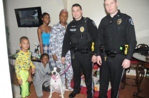 The Lawrence family, Cincere, Zaikil, Tabrea and Chaneka pose with Tullytown officers Andrew Seltzer and Justin Grotz and,of course Mickey Credit: Alex Lloyd Gross/ LevittownNow.com