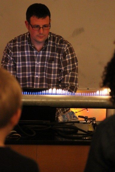 Teacher Hank Oppenheimer showing off a Rubens' tube. Credit: Tom Sofield/LevittownNow.com