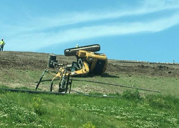 Construction Equipment Tumbles Down Hill At Landfill