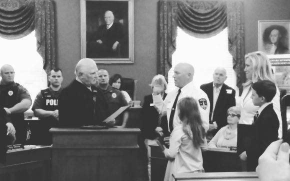 District Judge Frank Peranteau Sr., a former Bristol chief, swears in Chief Steven Henry. Credit: Tom Sofield/LevittownNow.com