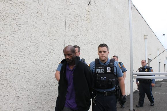 Kim Goldsboro being led to his arraignment by police.  Credit: Tom Sofield/LevittownNow.com