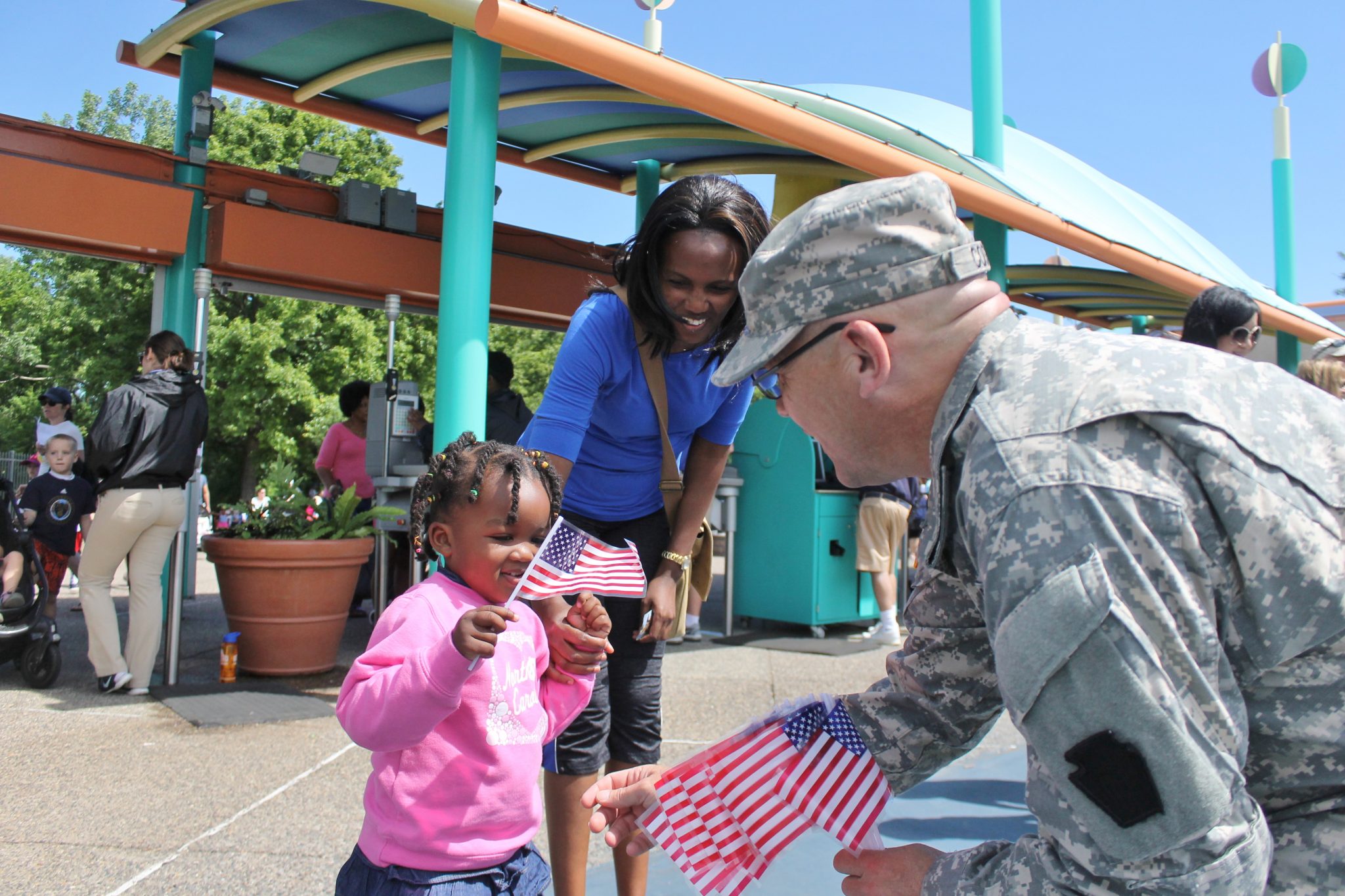 Military Members Hand Out American Flags At Sesame Place