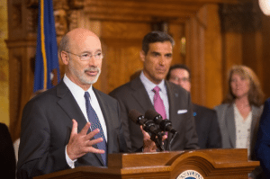 Gov. Tom Wolf with Jay Wright speaking at the capitol.  Credit: State of PA