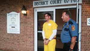 Constable Kevin Wagner walking Matthew Lily out of court Wednesday. Credit: Tom Sofield/LevittownNow.com