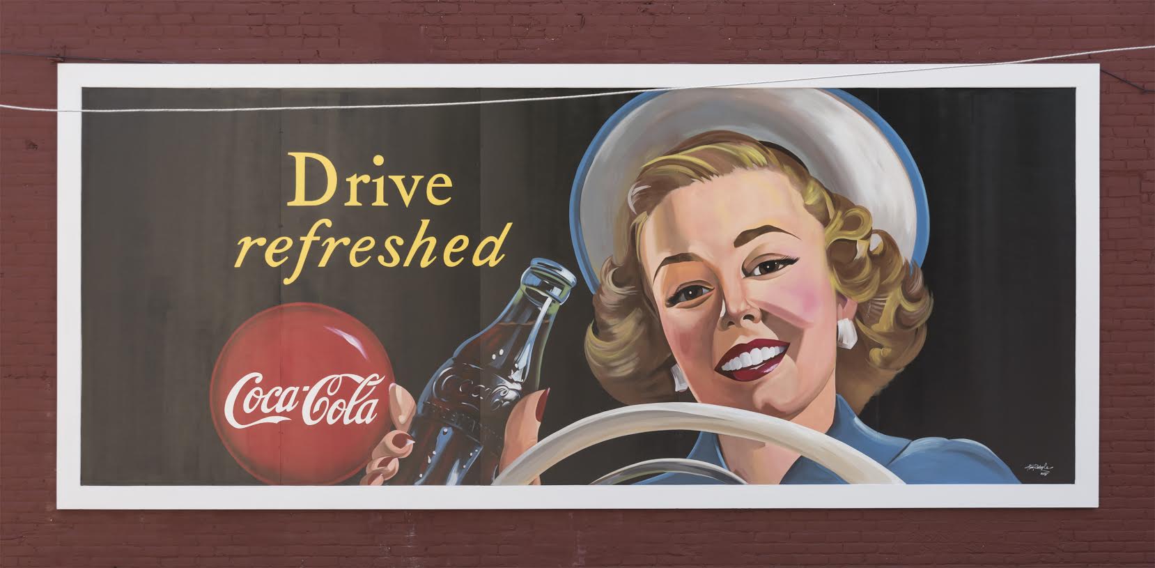 Iconic Coke Mural Returns To Historic Bristol