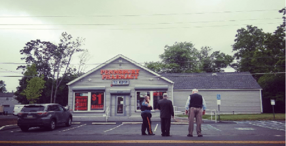 Falls Township Lt. Hank Ward, Bucks County Chief Detective Chris McAteer and District Attorney David Heckler standing outside the Pennsbury Pharmacy on New Falls Road after a shooting earlier this year.  Credit: Tom Sofield/LevittownNow.com