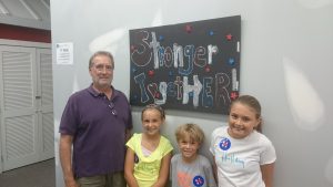 Paul Hampel, with the artists of the sign, Eliza, Ben, and Ava. Credit: Erich Martin/Levittownnow.com