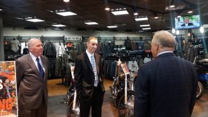 PA Chamber President Gene Barr and candidate Brian Fitzpatrick listen to Brian's Harley Davidson owner Brian Bentley Monday. Credit: Tom Sofield/LevittownNow.com