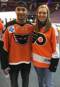 Rowan Haldeman with Phantoms forward Tyrell Goulbourne. Credit: Center for Independent Living of Bucks County