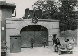 American soliders gaurd Dachau concentration camp after taking control from the Nazis.  Credit: National Archives/ZUMA Press
