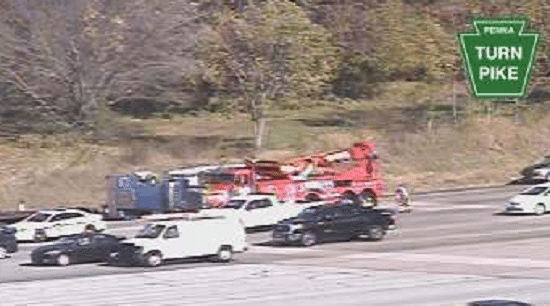 Dump Truck Overturns Near Turnpike Toll Plaza