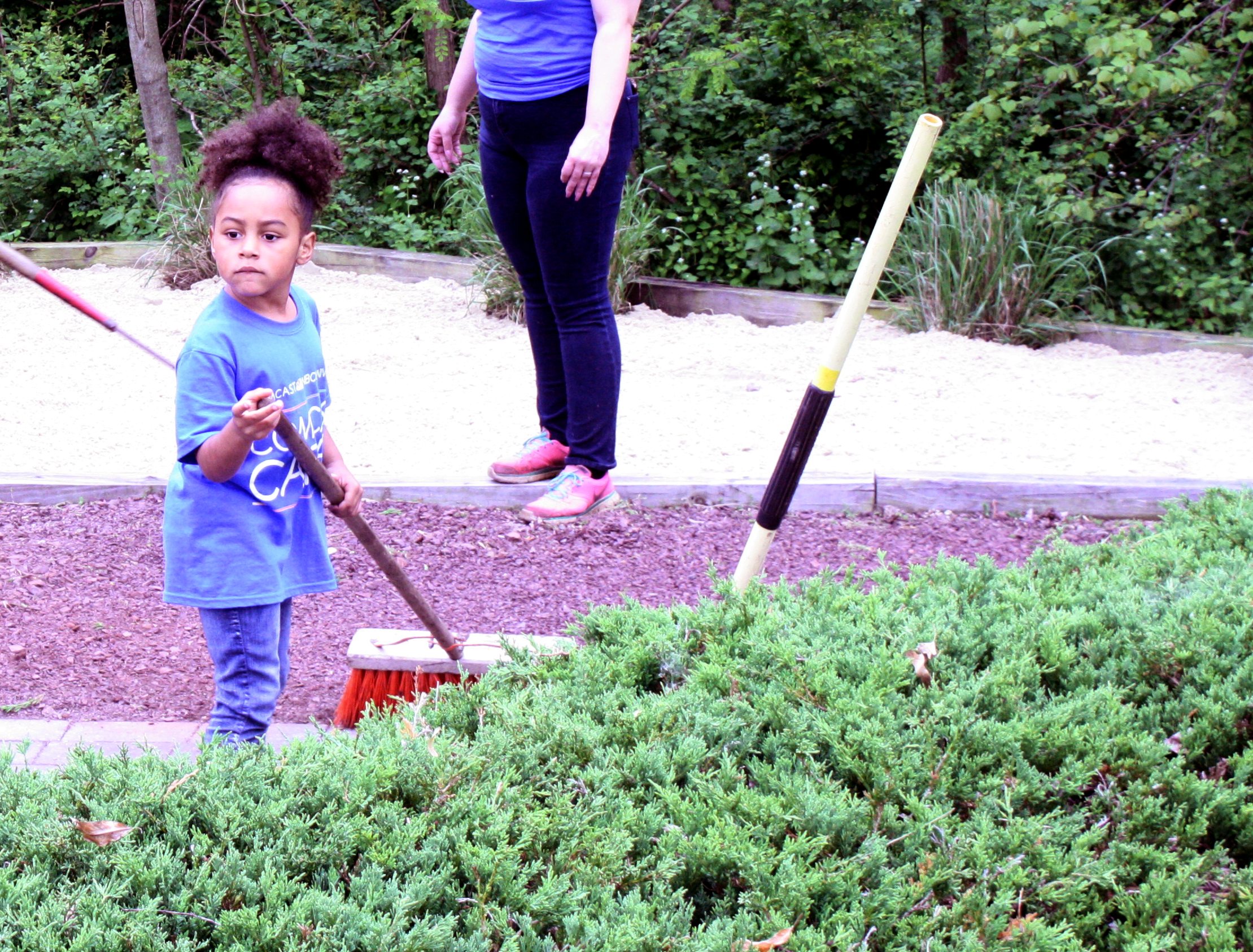 Volunteers From Comcast Take To Detective Christopher Jones Memorial Park