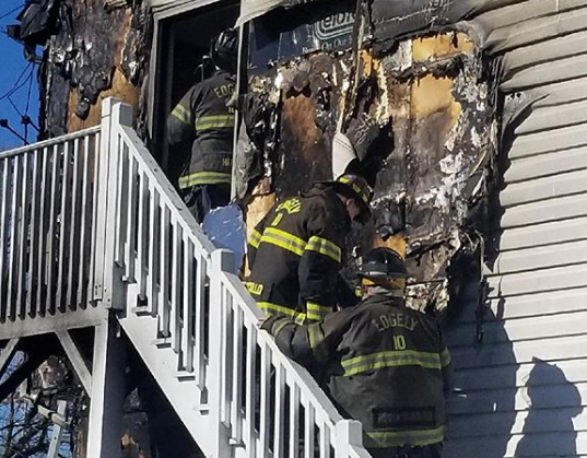 Exterior Of Home Damaged By Flames