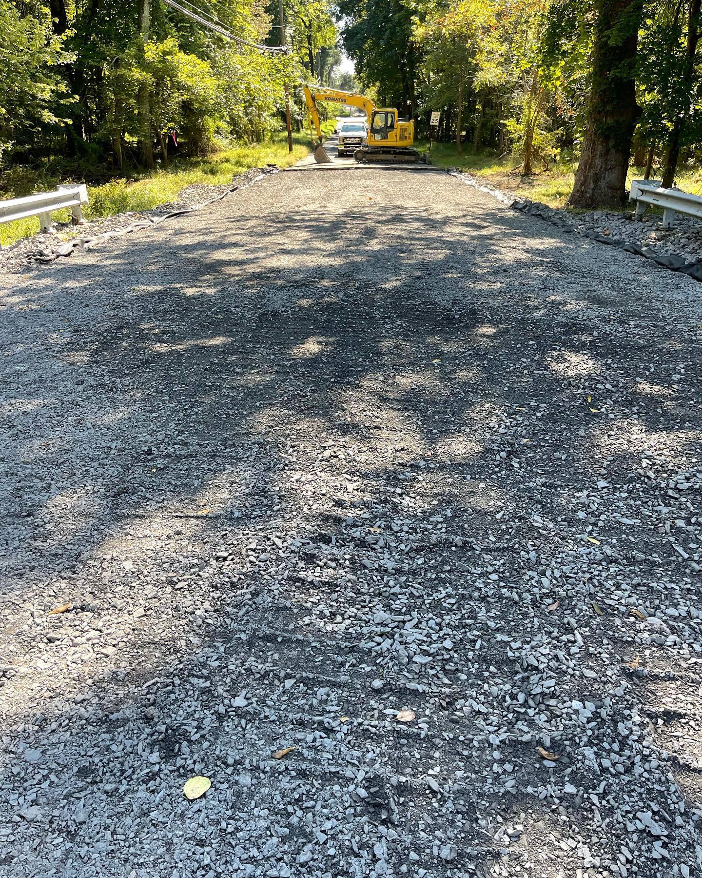 Road Washed Out By Recent Storm Being Repaired