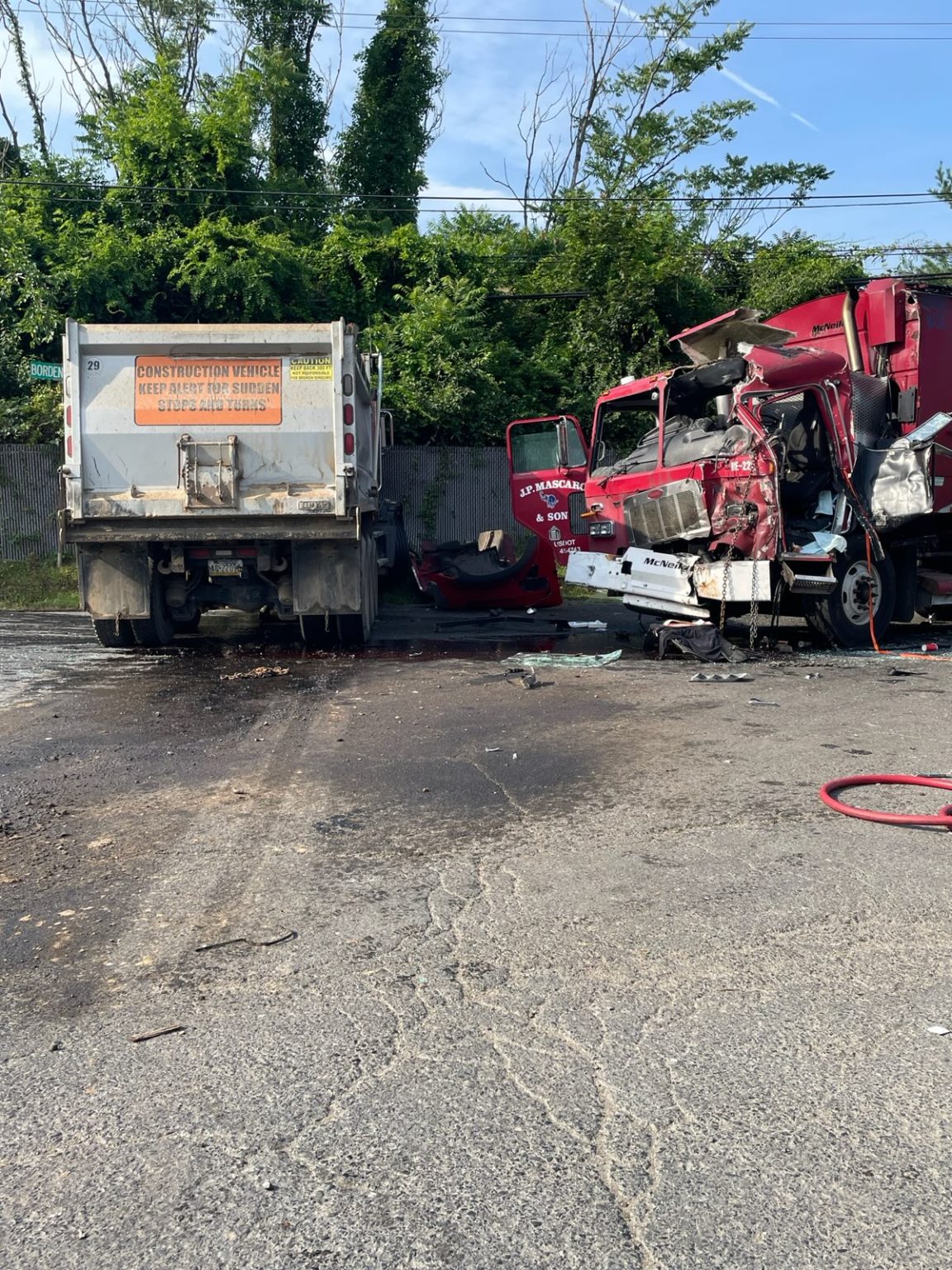 Driver Of Dump Truck Charged With Crash That Badly Hurt Trash Truck ...