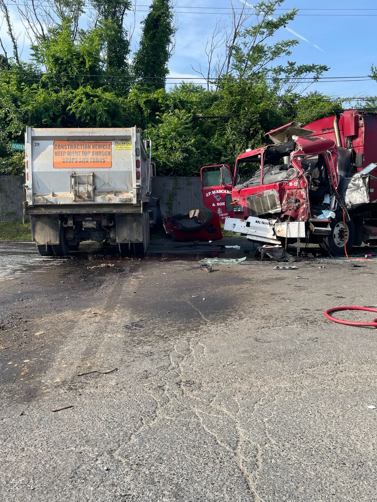 Driver Of Dump Truck Charged With Crash That Badly Hurt Trash Truck Driver